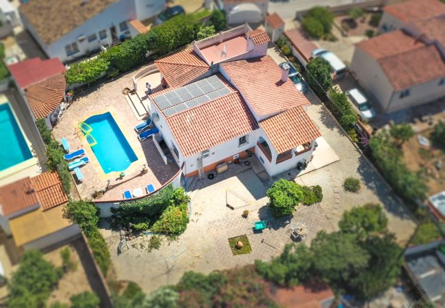 Aerial view of the villa for rent Calpe near Playa Calalga and its private plot. 