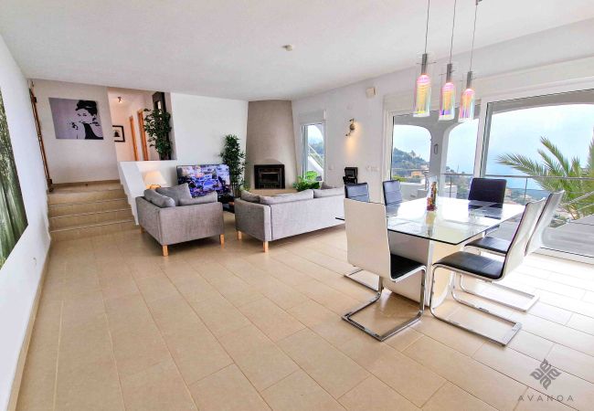 Villa in Sierra Altea with large window in dining room with views.