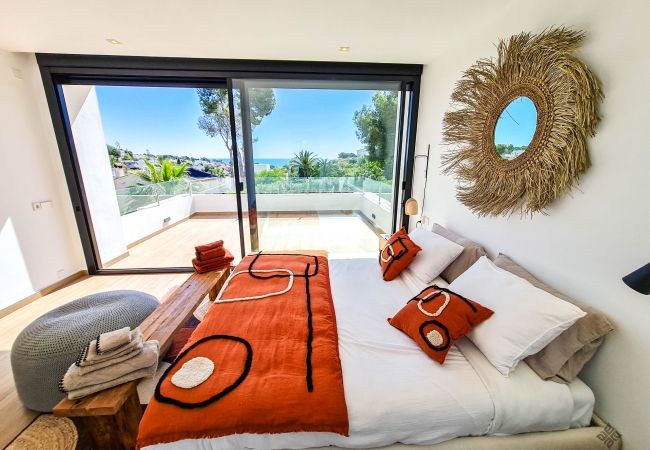 Double bed, terrace, pool and sea views.