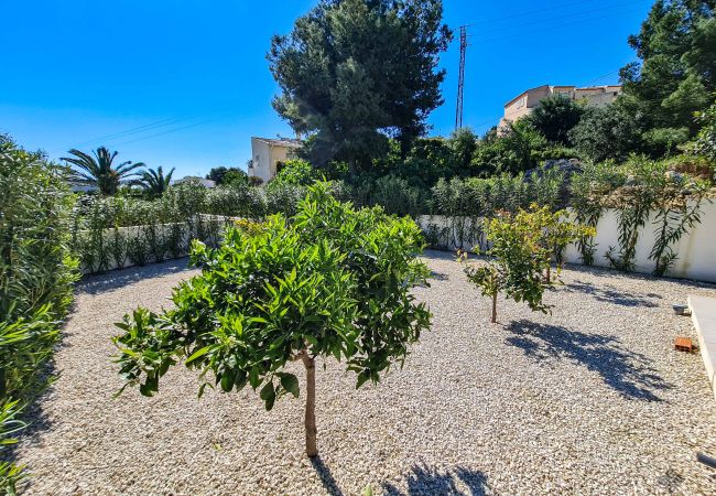 Villa in Benissa with beautiful garden next to the pool.
