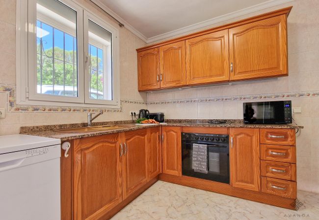 Large kitchen with direct access from ground floor.