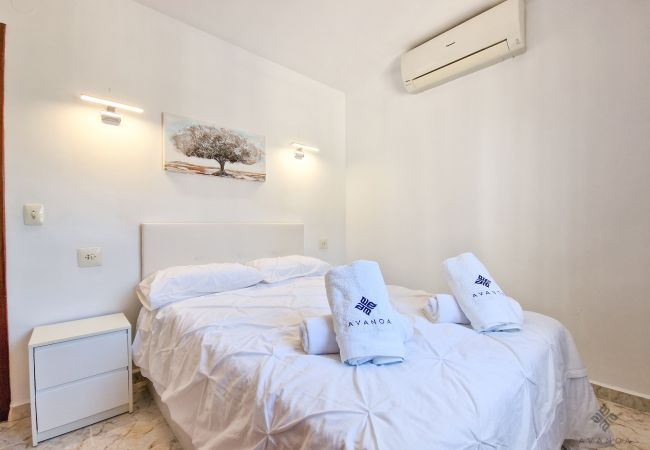 Bright bedroom with hot/cold air conditioning. 