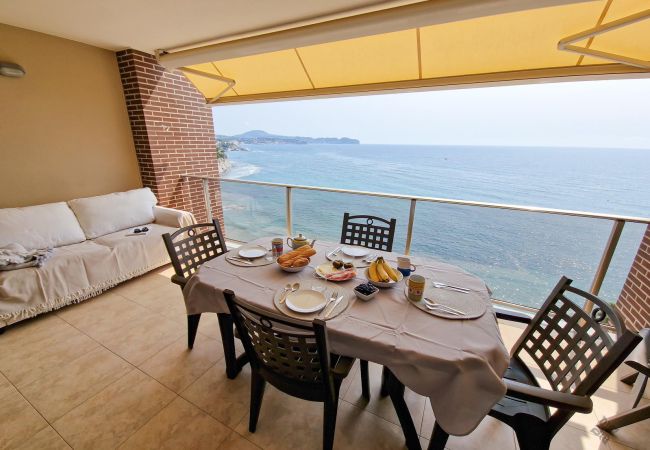 Terrace with furniture and sea views.